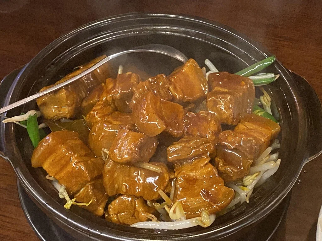 Shanghai-style hong shao rou pork belly served as a rich shared dish