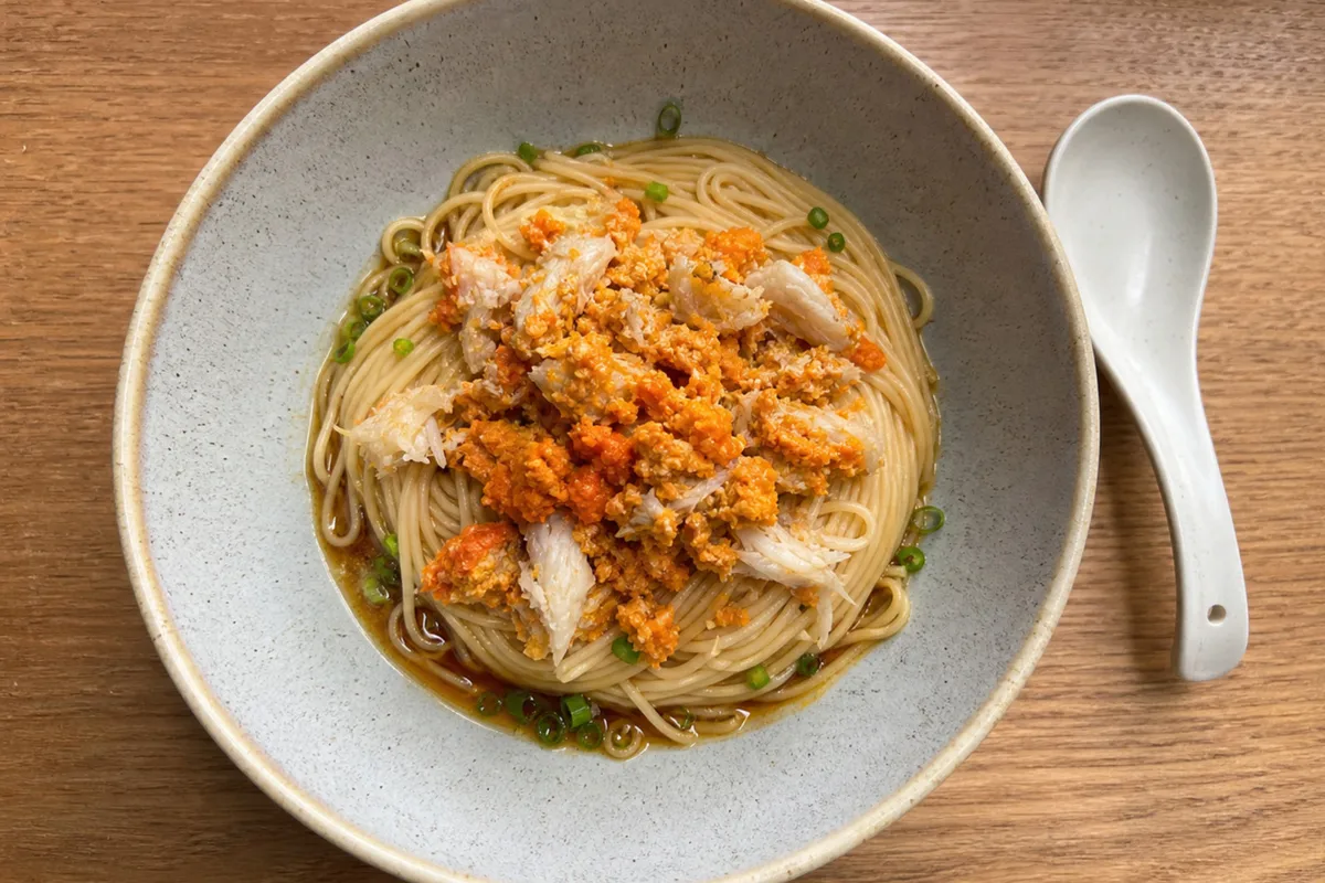 Crab roe noodles with vinegar and ginger for balance in Shanghai dining