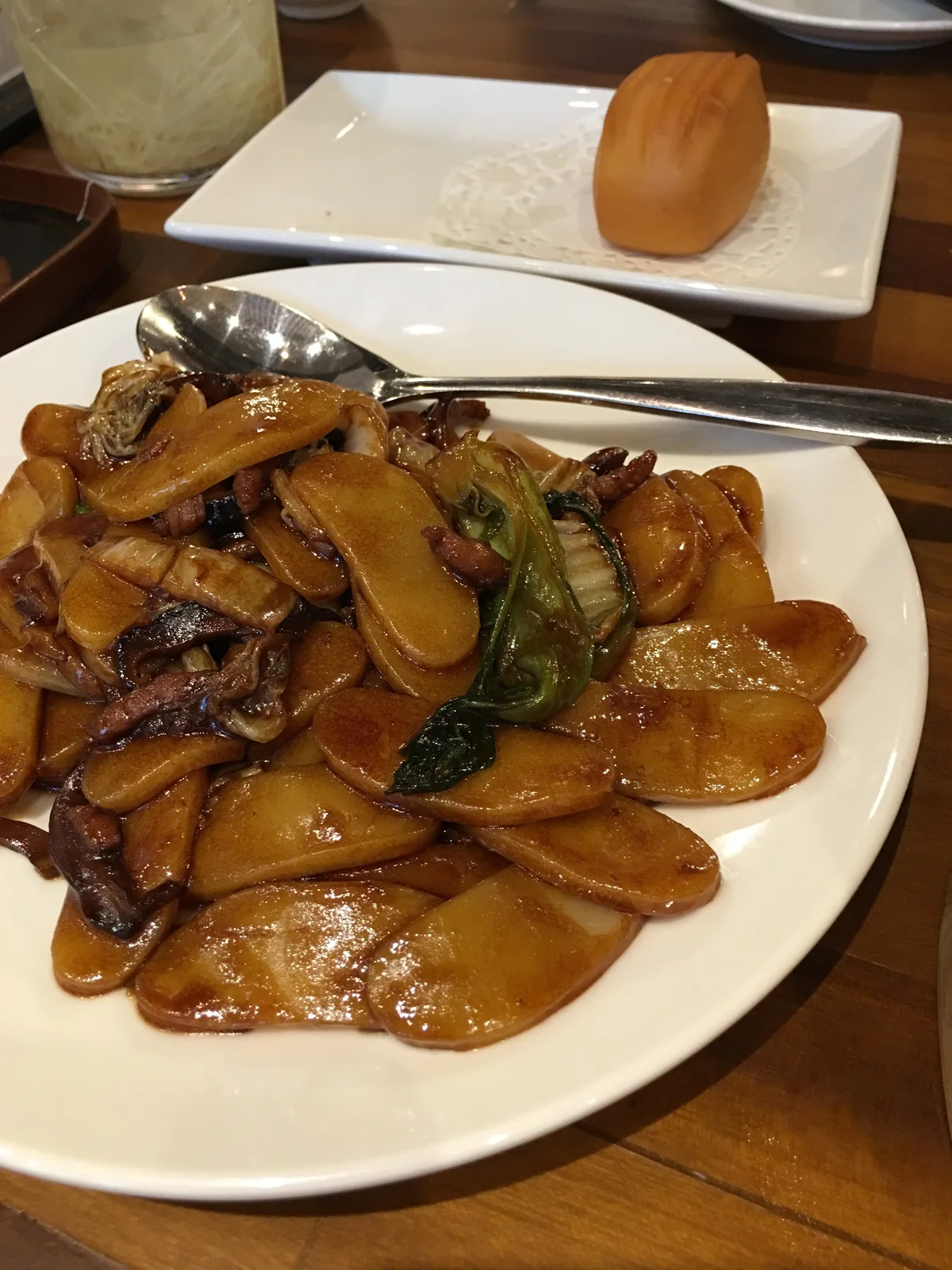 Wok-fried Shanghai rice cakes with preserved vegetables and salted meat