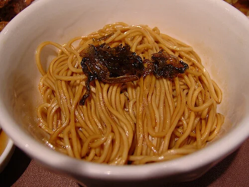 Small bowl of Shanghai oil noodles with dark sauce