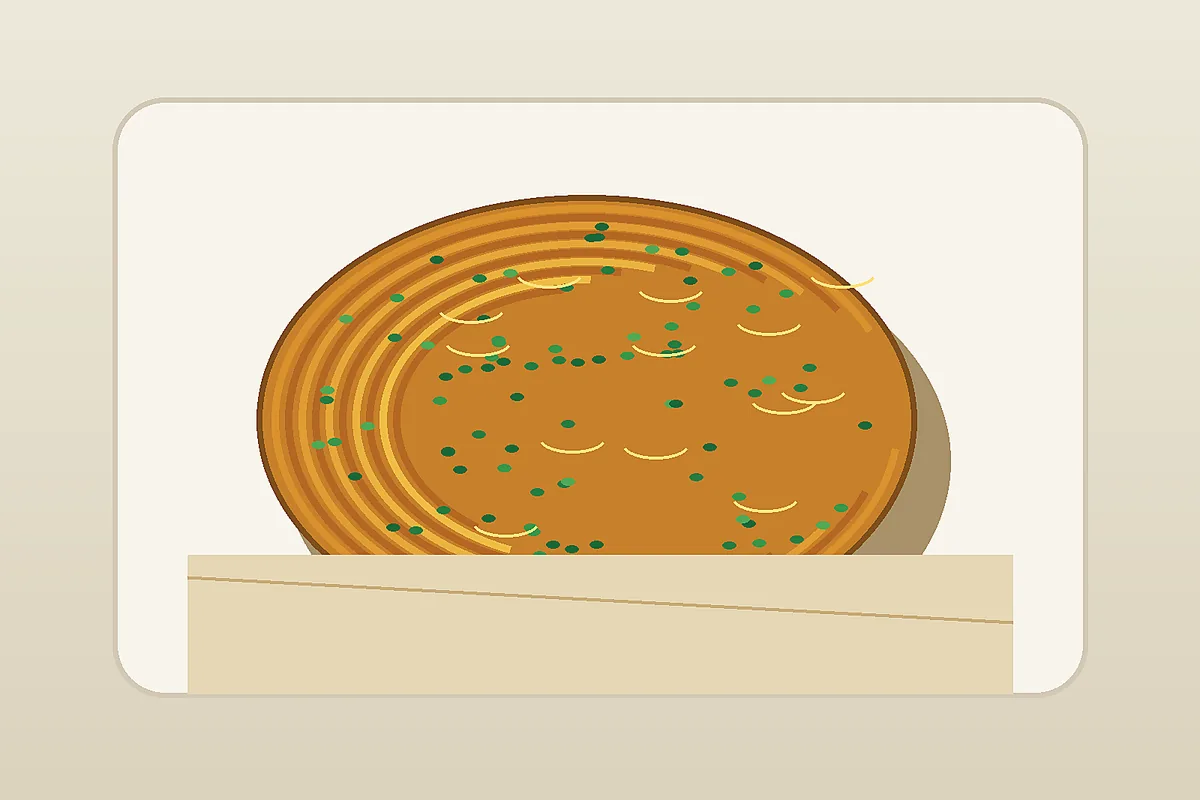 Shanghai scallion pancake in a paper bag showing street snack texture
