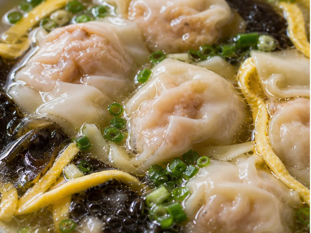 Shanghai wontons in clear soup with scallions and egg strips