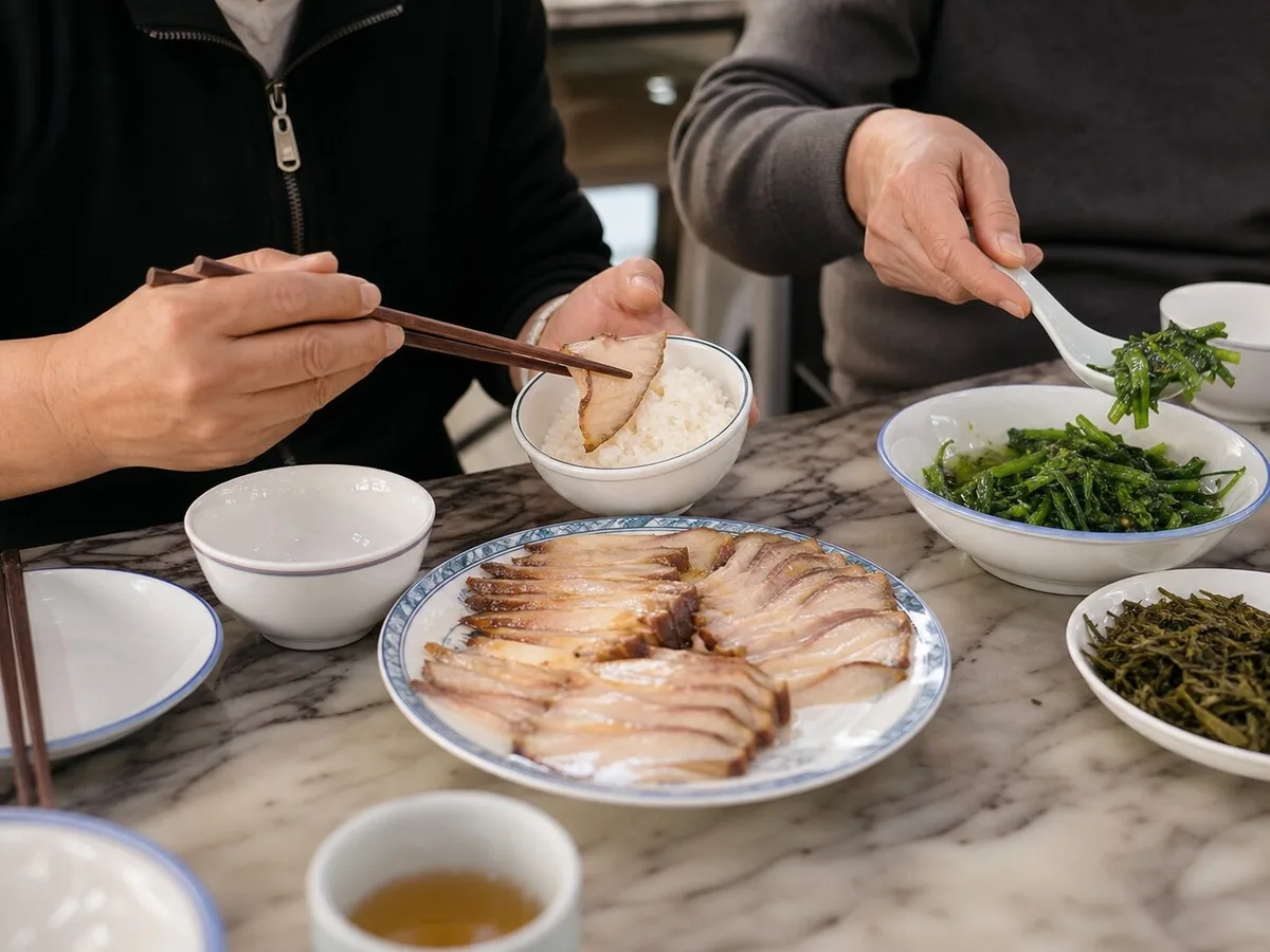Diners serving Shanghai smoked fish and greens onto rice bowls at a shared table