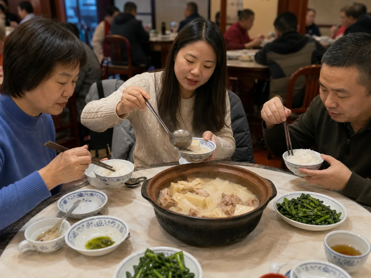 Three diners sharing Shanghai yanduxian soup, rice, and leafy greens at a neighborhood restaurant